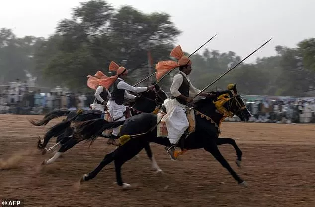 festooned with garlands and colourful bridles turbaned riders mounted on horseback in full gallop lower their lances at tiny wooden blocks as they practice the centuries old tradition of tent pegging photo afp festooned with garlands and colourful bridles turbaned riders mounted on horseback in full gallop lower their lances at tiny wooden blocks as they practice the centuries old tradition of tent pegging photo afp