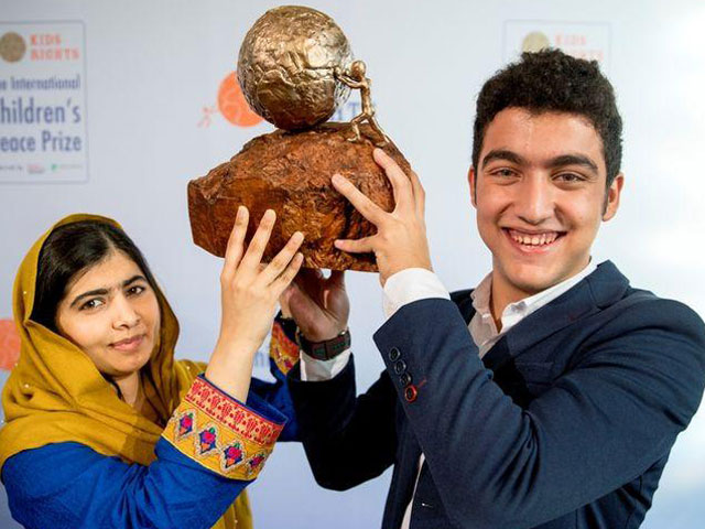 mohamad al jounde 16 is awarded the 2017 international children 039 s peace prize by malala yousafzai the youngest recipient of the nobel peace prize at the hague netherlands december 4 2017 photo kidsrights