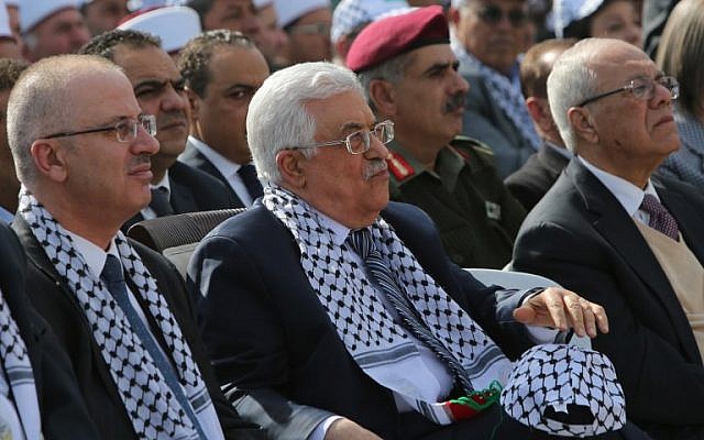 pa president mahmoud abbas and pa prime minister rami hamdallah during a ceremony to mark the tenth anniversary of the death of late palestinian leader yasser arafat in the west bank city of ramallah photo afp