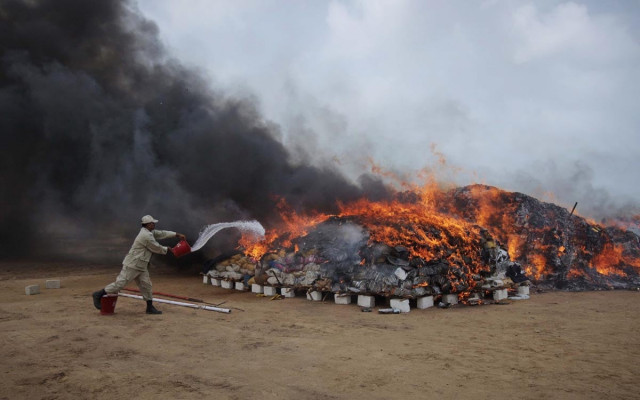 file photo a coast guard officer pours kerosene oil on a burning pile of confiscated hashish and bags of betel nuts during a campaign to mark the international day against drug abuse and illicit trafficking on the outskirts of karachi june 26 2012 photo reuters file photo a coast guard officer pours kerosene oil on a burning pile of confiscated hashish and bags of betel nuts during a campaign to mark the international day against drug abuse and illicit trafficking on the outskirts of karachi june 26 2012 photo reuters
