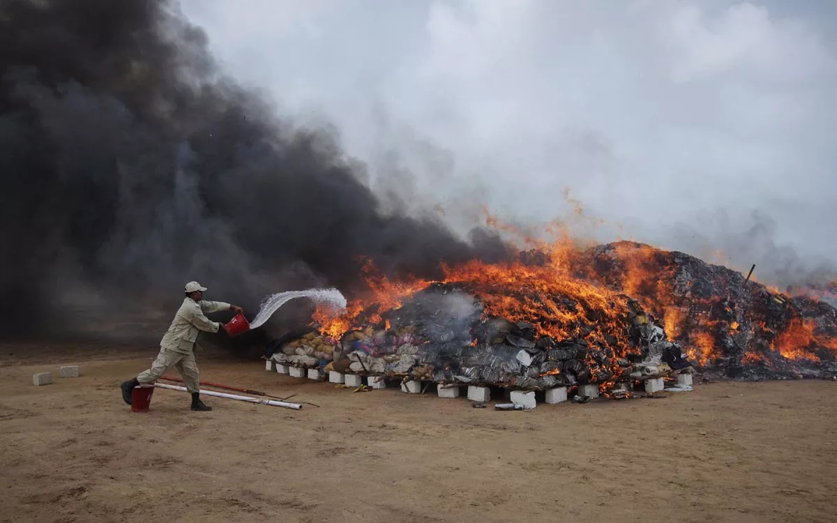 file photo a coast guard officer pours kerosene oil on a burning pile of confiscated hashish and bags of betel nuts during a campaign to mark the international day against drug abuse and illicit trafficking on the outskirts of karachi june 26 2012 photo reuters file photo a coast guard officer pours kerosene oil on a burning pile of confiscated hashish and bags of betel nuts during a campaign to mark the international day against drug abuse and illicit trafficking on the outskirts of karachi june 26 2012 photo reuters