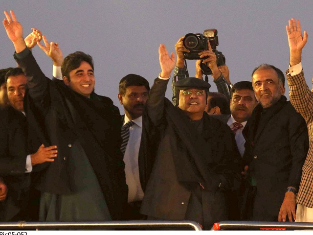 ppp chairman bilawal bhutto zardari and co chairman asif ali zardari wave at party workers at parade ground in islamabad on tuesday photo online