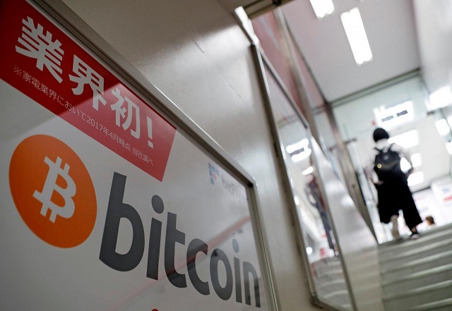 a logo of bitcoin is seen on an advertisement of an electronic shop in tokyo japan september 5 2017 photo reuters