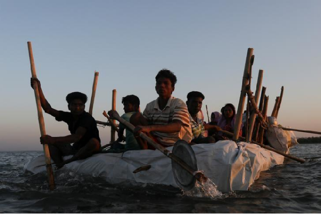 rohingya refugees sail on an improvised raft across the naf river to reach bangladesh in teknaf bangladesh november 29 2017 photo reuters