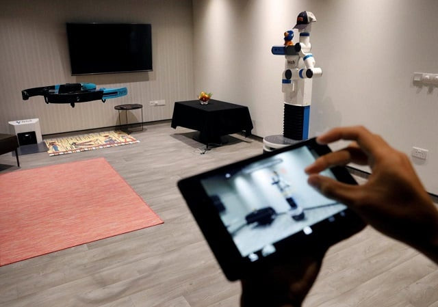 nus school of computing researcher lan ziquan showcases their project xpose an interactive drone photo taking system at their faculty premises in singapore november 27 2017 picture taken november 27 2017 photo reuters nus school of computing researcher lan ziquan showcases their project xpose an interactive drone photo taking system at their faculty premises in singapore november 27 2017 picture taken november 27 2017 photo reuters