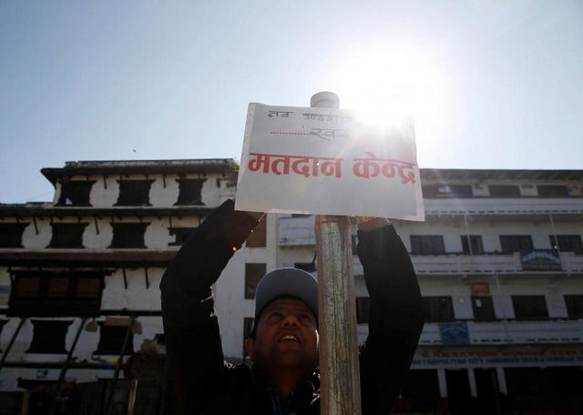 an election officer sets up a sign that reads quot polling station quot a day ahead of the parliamentary and provincial elections in kathmandu nepal december 6 2017 photo reuters an election officer sets up a sign that reads quot polling station quot a day ahead of the parliamentary and provincial elections in kathmandu nepal december 6 2017 photo reuters