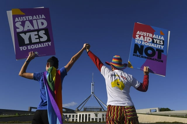 same sex marriage campaigners pose for pictures during an equality rally outside parliament house in canberra december 7 2017 photo via reuters same sex marriage campaigners pose for pictures during an equality rally outside parliament house in canberra december 7 2017 photo via reuters