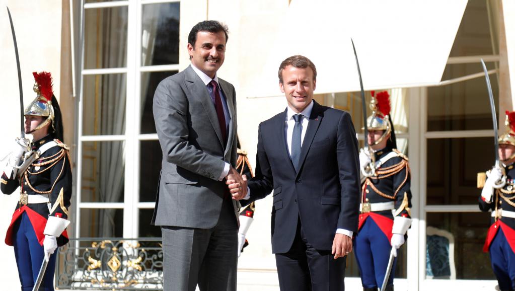 qatar s emir sheikh tamim bin hamad al thani l and french president macron r ink a deal qatar buys 12 rafale fighter jets from france amid gulf crisis photo reuters