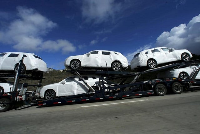 new vehicles covered in protective wrapping are shipped by a transport truck along interstate highway 5 north of san diego california us on january 7 2016 photo reuters new vehicles covered in protective wrapping are shipped by a transport truck along interstate highway 5 north of san diego california us on january 7 2016 photo reuters