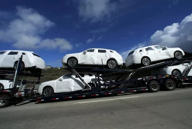 new vehicles covered in protective wrapping are shipped by a transport truck along interstate highway 5 north of san diego california us on january 7 2016 photo reuters new vehicles covered in protective wrapping are shipped by a transport truck along interstate highway 5 north of san diego california us on january 7 2016 photo reuters