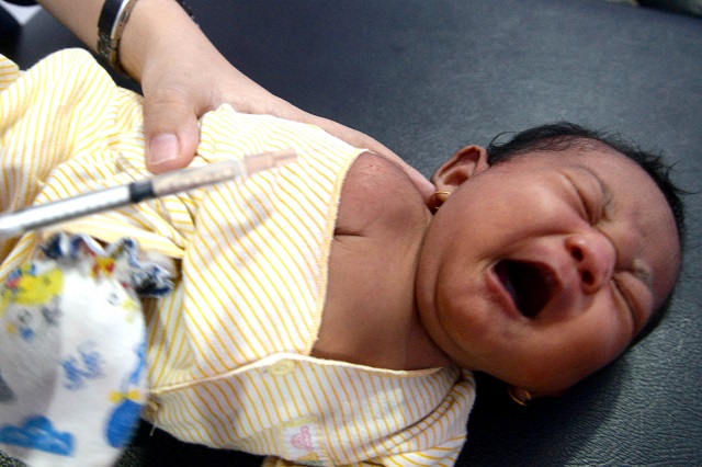 a baby cries during diphtheria immunisation at a clinic in cibinong bogor west java south of jakarta indonesia december 5 2017 in this photo taken by antara foto picture taken december 5 2017 photo via reuters