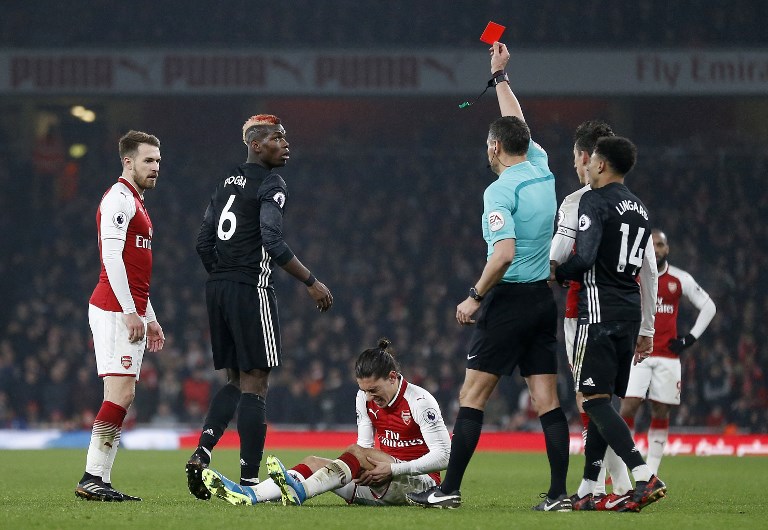 pogba s tackle on bellerin in united s 3 1 win over arsenal saw him receive a straight red that rules him out of the manchester derby photo afp