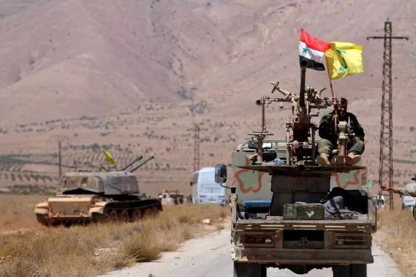 hezbollah and syrian flags flutter on a military vehicle in western qalamoun syria photo reuters hezbollah and syrian flags flutter on a military vehicle in western qalamoun syria photo reuters