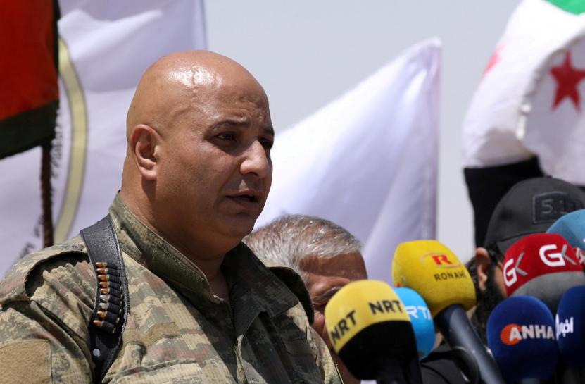 then syrian democratic forces sdf spokesperson talal silo speaks during a press conference in hukoumiya village in raqqa syria photo reuters