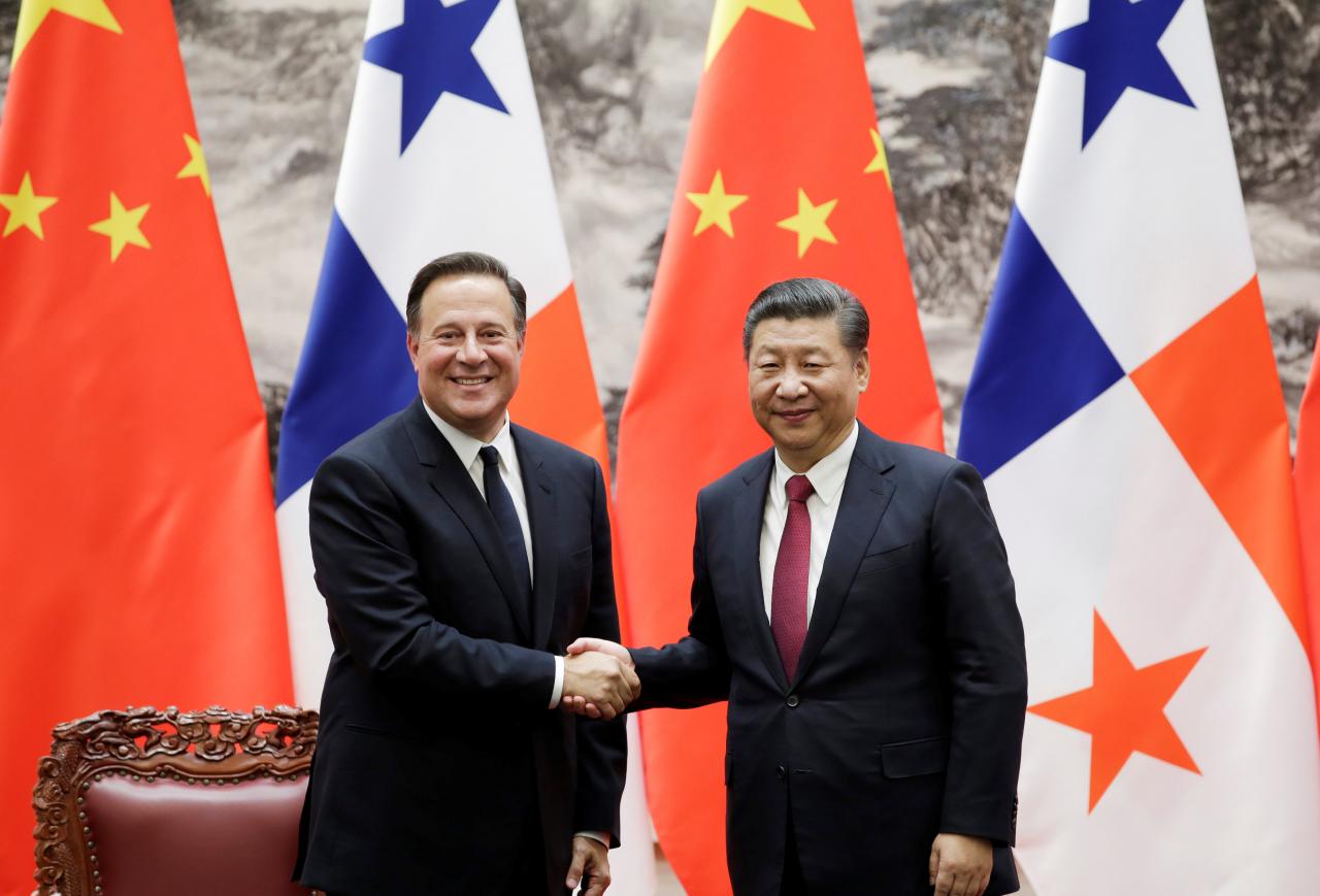 panama s president juan carlos varela shakes hands with china 039 s president xi jinping during a signing ceremony in beijing china photo reuters