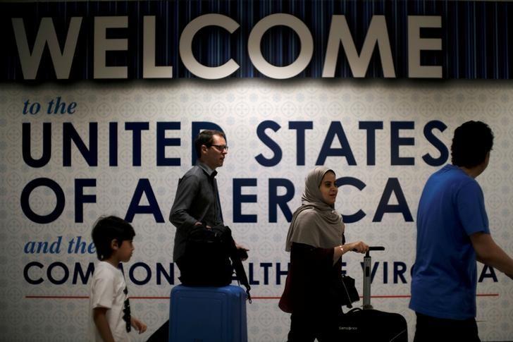 international passengers arrive at washington dulles international airport after the us supreme court granted parts of the trump administration 039 s emergency request to put its travel ban into effect later in the week pending further judicial review in dulles virginia photo reuters