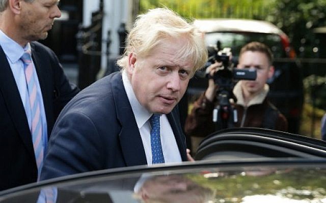 british foreign secretary boris johnson gets into a car as he leaves his home in london photo afp