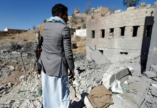 a yemeni man looks at the damage caused by an alleged air strike by the saudi led coalition on a rebel controlled tv station in sanaa photo afp a yemeni man looks at the damage caused by an alleged air strike by the saudi led coalition on a rebel controlled tv station in sanaa photo afp