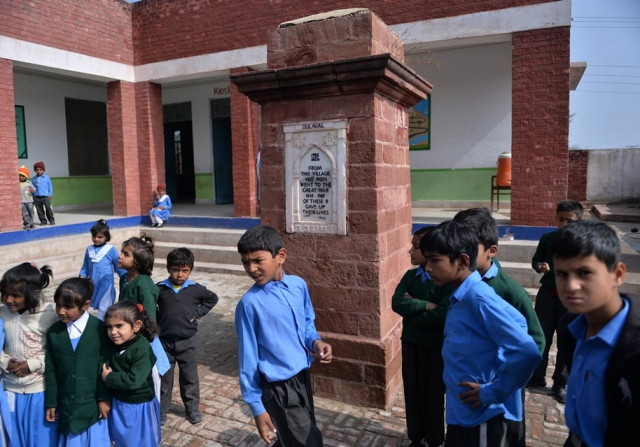 this photograph taken on october 29 2014 shows schoolchilldren stand beside a monument of the veterans of wwi at a school in village dulmial in chakwal district in punjab province around 150 kilometres south of islamabad this photograph taken on october 29 2014 shows schoolchilldren stand beside a monument of the veterans of wwi at a school in village dulmial in chakwal district in punjab province around 150 kilometres south of islamabad