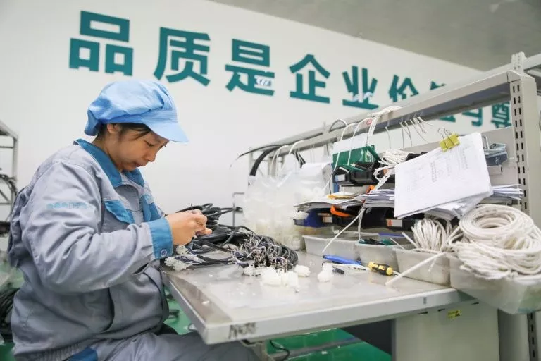 a woman working in a factory in jiangsu province china earlier this month photo afp a woman working in a factory in jiangsu province china earlier this month photo afp