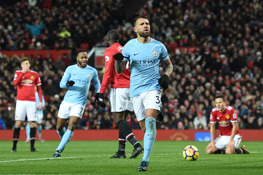 manchester city 039 s argentinian defender nicolas otamendi c celebrates scoring their second goal during the english premier league football match between manchester united and manchester city at old trafford in manchester north west england on december 10 2017 photo afp