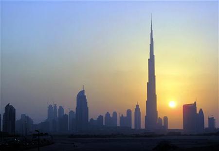 the burj khalifa c skyscraper is seen as the sun sets over dubai photo reuters