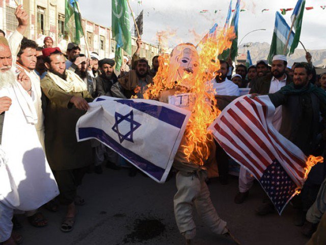 protesters burn an effigy depicting us president donald trump during an anti us and israel protest in quetta on december 8 2017 photo afp