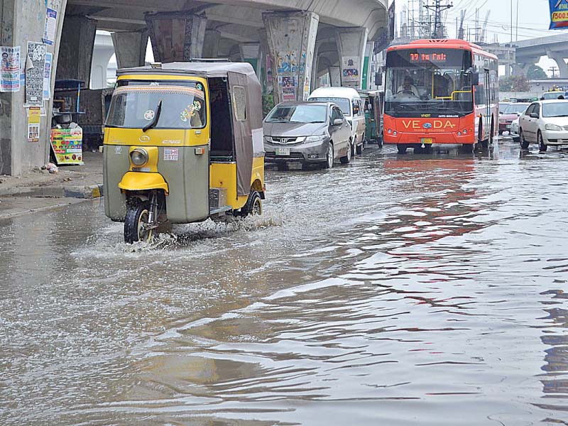 vehicles pass through accumulated rainwater at chungi no 9 in multan photo app