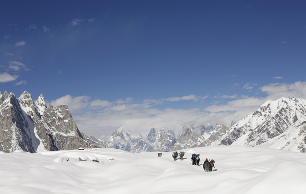 trekkers and porters hike down the baltoro glacier in the karakoram mountain range in pakistan photo reuters