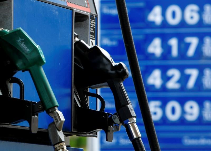 gas and diesel pumps along with gas prices are shown at a gas station photo reuters