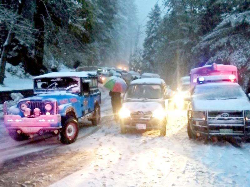 vehicles wait for the snow covered roads to open in murree photo agencies