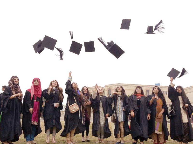 students toss their hats during the convocation photo inp