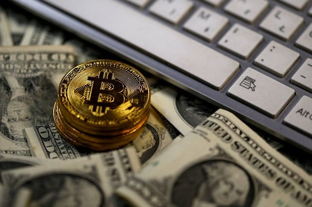 bitcoin coins placed on dollar banknotes next to computer keyboard are seen in this illustration picture november 6 2017 photo reuters bitcoin coins placed on dollar banknotes next to computer keyboard are seen in this illustration picture november 6 2017 photo reuters