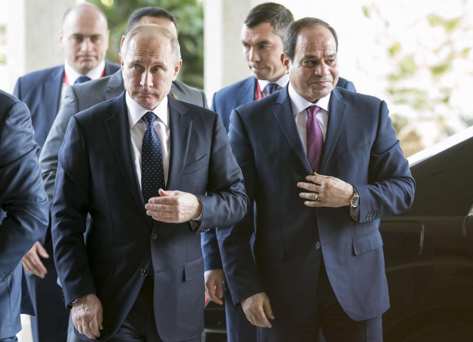 russia 039 s president vladimir putin l and egypt 039 s president abdel fattah al sisi walk during a meeting in cairo photo reuters