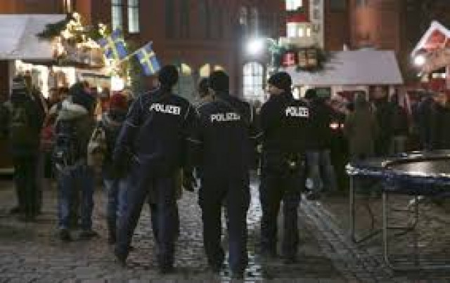 german police officers guard a christmas market in the prenzlauer berg district in eastern berlin photo reuters