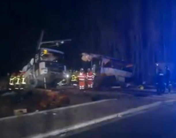 rescue workers are seen on the site of collision between train and school bus in millas france december 14 2017 in this handout still image from a video photo reuters