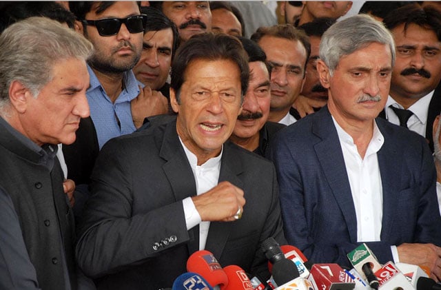 pakistan tehreek e insaf 039 s general secretary jahangir khan tareen r stands as party chief imran khan addresses media outside supreme court building after a hearing into panama scandal case on thursday november 3 2016 photo online