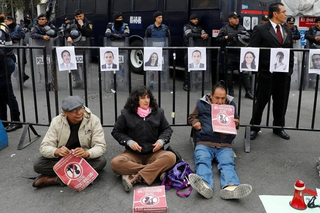 activists hold a protest against a law that militarises crime fighting in the country outside the senate in mexico city mexico december 14 2017 placards read quot no to the militarisation in the country quot photo reuters activists hold a protest against a law that militarises crime fighting in the country outside the senate in mexico city mexico december 14 2017 placards read quot no to the militarisation in the country quot photo reuters
