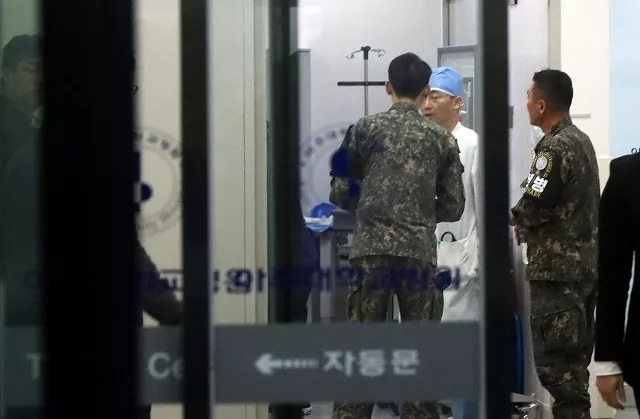 a south korean soldier talks with a surgeon at a hospital where a north korean soldier who defected to the south after being shot and wounded by the north korean military is hospitalized in suwon south korea photo via reuters a south korean soldier talks with a surgeon at a hospital where a north korean soldier who defected to the south after being shot and wounded by the north korean military is hospitalized in suwon south korea photo via reuters