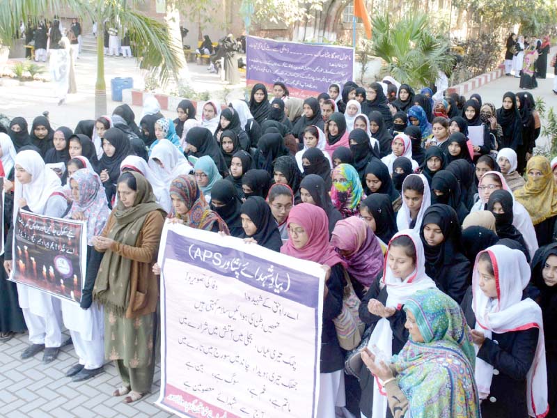 students offer prayers during a rally to remark the 3rd anniversary of aps tragedy photo online