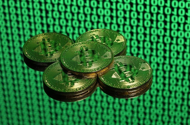 tokens of the virtual currency bitcoin are seen placed on a monitor that displays binary digits in this illustration picture december 8 2017 picture taken december 8 photo reuters tokens of the virtual currency bitcoin are seen placed on a monitor that displays binary digits in this illustration picture december 8 2017 picture taken december 8 photo reuters