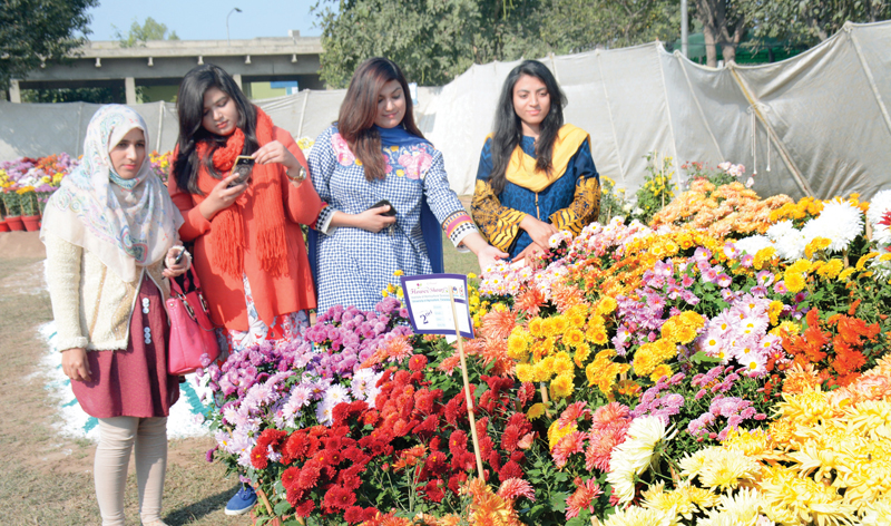 girls take keen interest at the flower show photo uaf