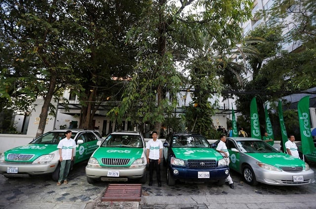 drivers stand near grab cars during a launch ceremony in phnom penh cambodia december 19 2017 photo reuters drivers stand near grab cars during a launch ceremony in phnom penh cambodia december 19 2017 photo reuters