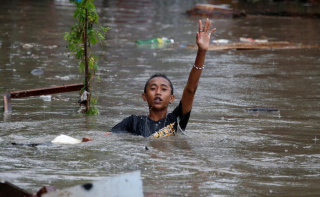 a resident wades in floodwaters in bacoor cavite as a storm sweeps across the main luzon island philippines september 12 2017 reuters erik de castro a resident wades in floodwaters in bacoor cavite as a storm sweeps across the main luzon island philippines september 12 2017 reuters erik de castro