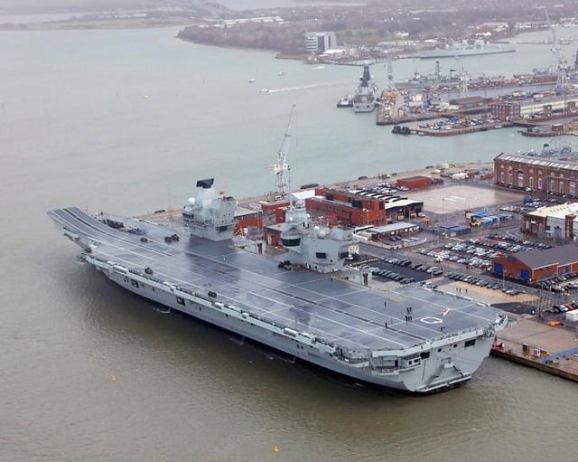 the royal navy 039 s aircraft carrier hms queen elizabeth is docked the day it was commissioned by britain 039 s queen elizabeth in portsmouth december 7 2017 photo via reuters