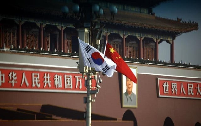 file photo south korean and chinese national flags hang from a pole in front of the portrait of former chinese chairman mao zedong at beijing 039 s tiananmen square january 9 2012 photo reuters file photo south korean and chinese national flags hang from a pole in front of the portrait of former chinese chairman mao zedong at beijing 039 s tiananmen square january 9 2012 photo reuters