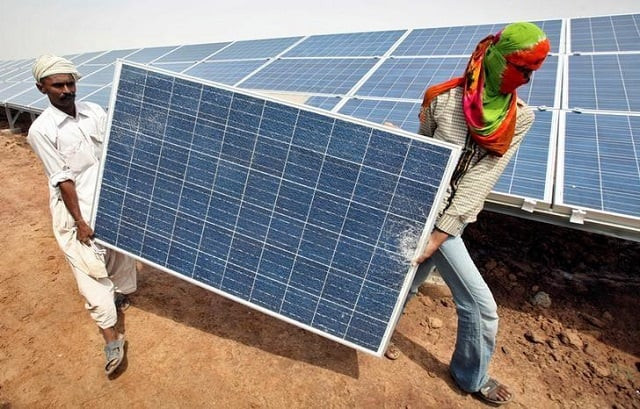 file photo workers carry a damaged photovoltaic solar panel at the gujarat solar park under construction in charanka village in the western indian state of gujarat india april 14 2012 photo reuters file photo workers carry a damaged photovoltaic solar panel at the gujarat solar park under construction in charanka village in the western indian state of gujarat india april 14 2012 photo reuters