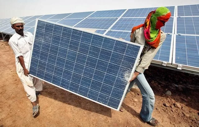 file photo workers carry a damaged photovoltaic solar panel at the gujarat solar park under construction in charanka village in the western indian state of gujarat india april 14 2012 photo reuters file photo workers carry a damaged photovoltaic solar panel at the gujarat solar park under construction in charanka village in the western indian state of gujarat india april 14 2012 photo reuters