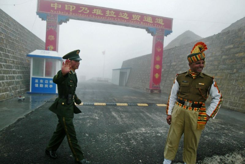 a chinese soldier and his indian counterpart at the ancient nathu la border crossing that remained closed for 44 years after the two asian countries fought a bitter war in 1962 photo afp