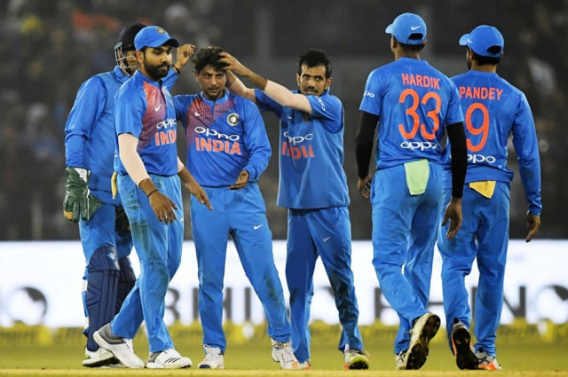 india 039 s yuzvendra chahal c with others congratulate teammate kuldeep yadav 3l after he took the wicket of unseen sri lankan batsman dasun shanaka during the first t20 international cricket match between india and sri lanka at the barabati stadium in cuttack on december 20 2017 photo afp india 039 s yuzvendra chahal c with others congratulate teammate kuldeep yadav 3l after he took the wicket of unseen sri lankan batsman dasun shanaka during the first t20 international cricket match between india and sri lanka at the barabati stadium in cuttack on december 20 2017 photo afp